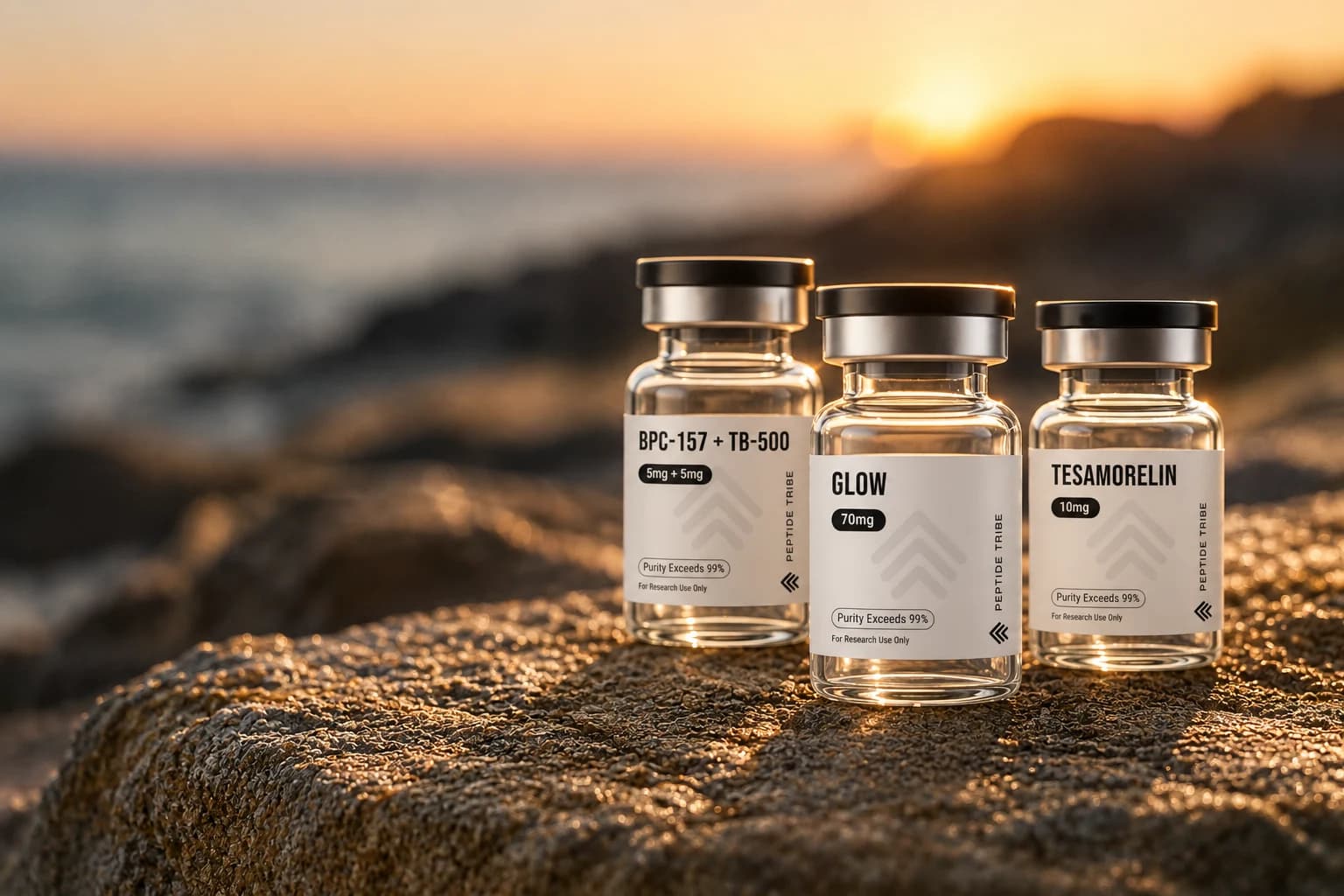 Peptide Tribe BPC-157 + TB-500, GLOW and Tesamorelin research vials on a coastal rock ledge at sunset